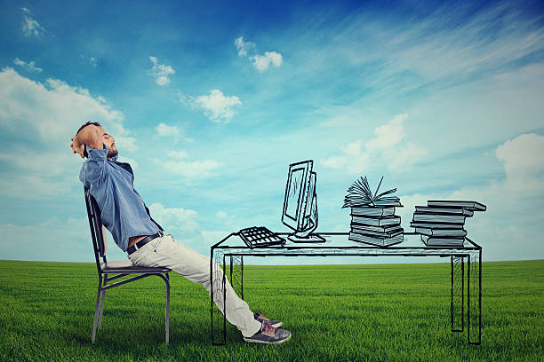 istock man relaxing at his desk outdoors 492323434