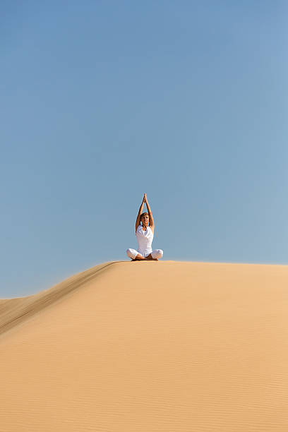istock Yoga meditation on the beach 492333125