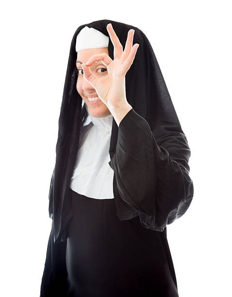 istock Young nun showing ok sign and smiling 492334265