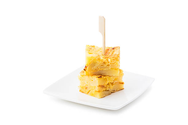 Potato omelette Spanish tapas. Tortilla de patatas toothpick isolated on white backround. tortilla de patatas stock pictures, royalty-free photos & images