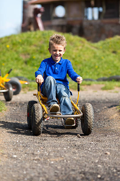 istock Caucasian boy having fun in moon buggy 492338065