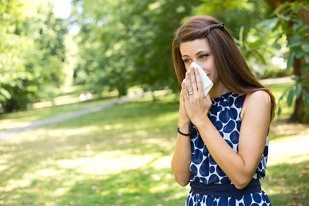 istock girl blowing nose 492357488