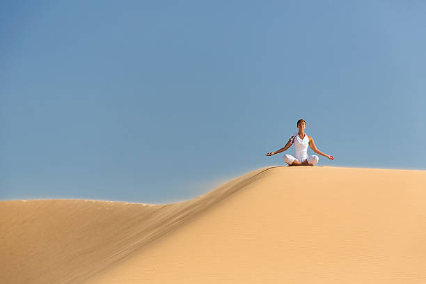 istock Yoga meditation on the beach 492360621