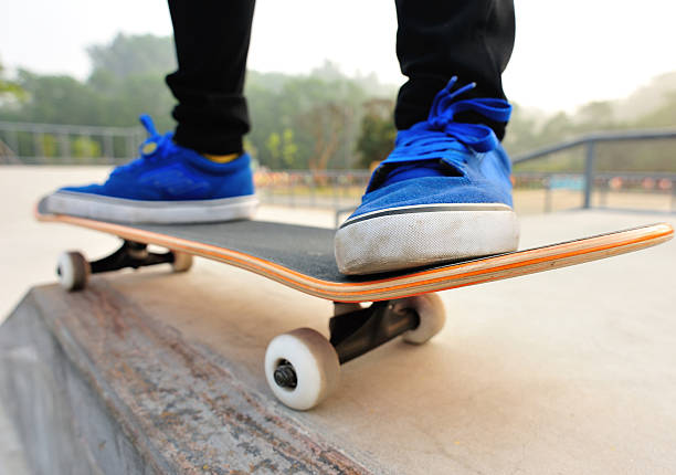 istock Legs in sneakers on a skateboard 492360639