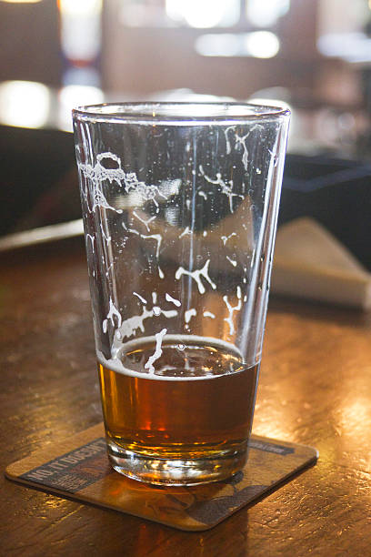 istock Mostly Drunk Glass of Beer On the Bar 492360749