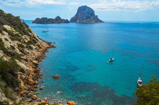 The islands and turquoise waters near Es Vedra Cala d'Hort in Ibiza, Spain.