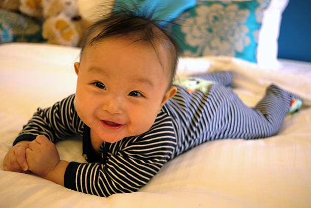 istock Finn Ng Release 1 - Baby on bed 1 492364221