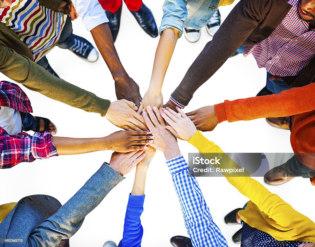 Group of Diverse Multiethnic People Teamwork Hands Clasped Stock Photo