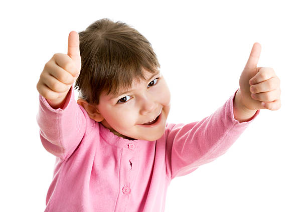 Cheerful girl showing thumbs up isolated one white background