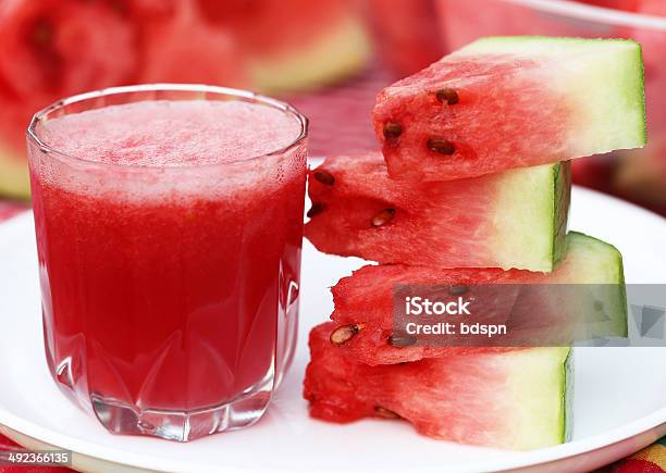 Watermelon Juice With Sliced Fruit On White Plate Stock Photo - Download Image Now - Chopped Food, Cold Drink, Cold Temperature