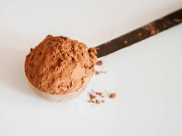 istock Brown chocolate powder on a spoon 492366656