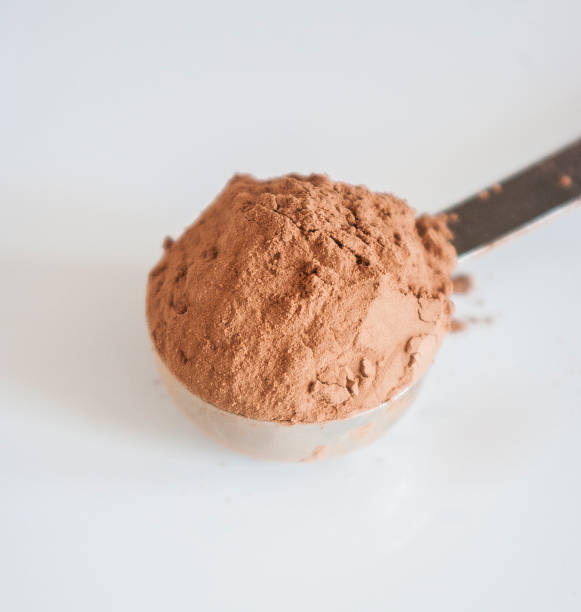 istock Brown chocolate powder on a spoon 492366756