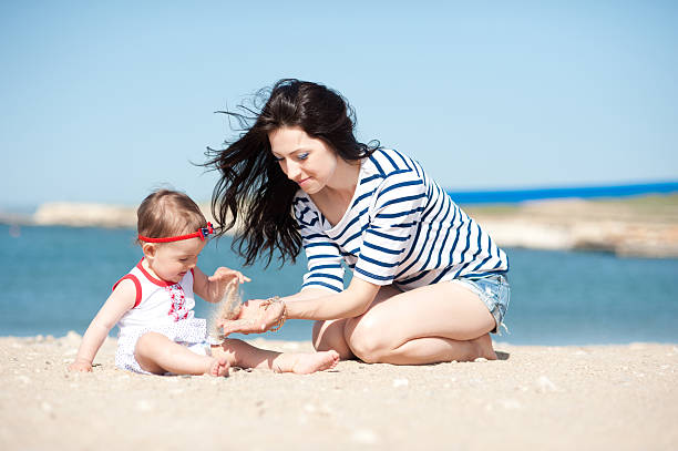 istock Young mother playing with baby girl 492368165