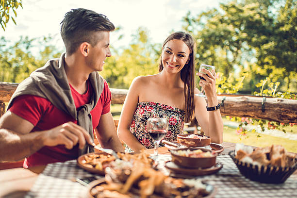 istock Smiling couple communicating during lunch in restaurant. 492369536