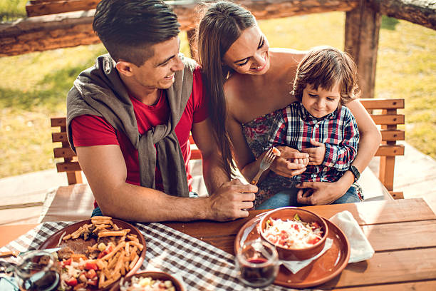 istock Young family eating in the restaurant. 492369626