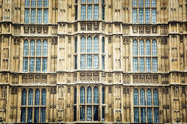 The Palace of Westminster is the meeting place of the House of Commons and the House of Lords, the two houses of the Parliament of the United Kingdom. Architectural theme.
