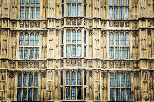 The Palace of Westminster is the meeting place of the House of Commons and the House of Lords, the two houses of the Parliament of the United Kingdom. Architectural theme.