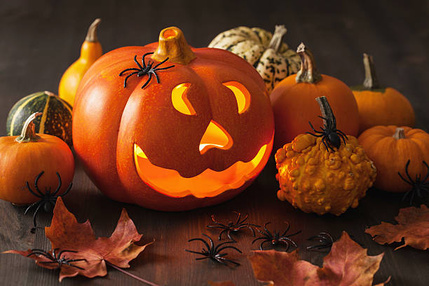 istock Halloween Jack O Lantern pumpkin spiders candles 492370746