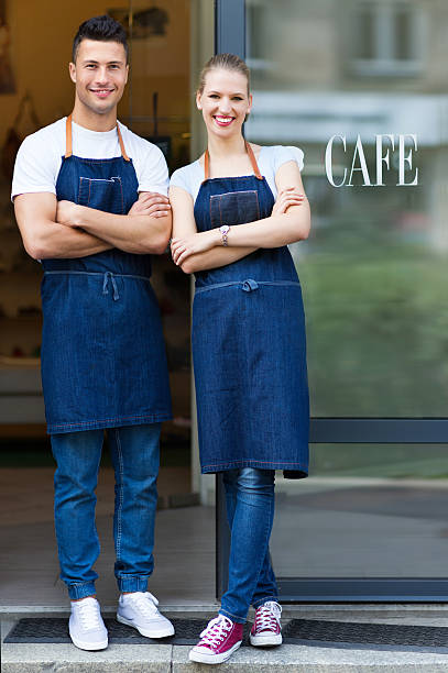 istock Young cafe owners in doorway 492383596