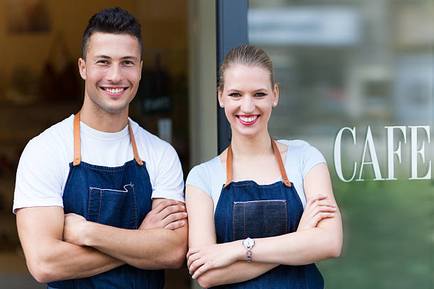 istock Young cafe owners in doorway 492383664
