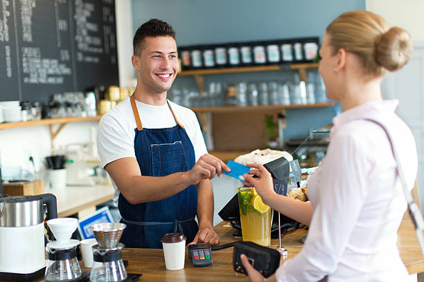 istock Woman paying for coffee 492385400
