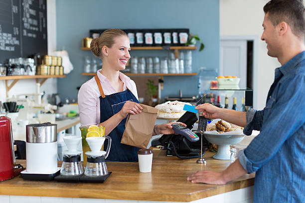 istock Waitress serving customer at the coffee shop 492385526