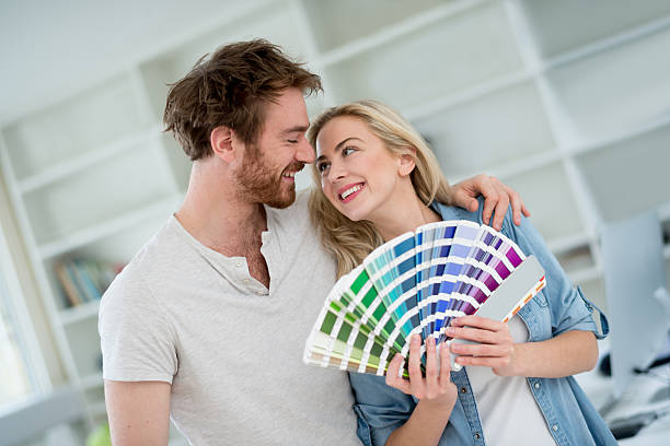 istock Young couple remodeling their house 492385870