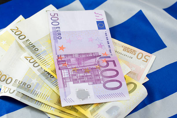 istock Euro bills on the Greek flag 492388040