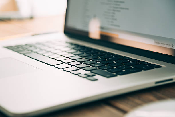 istock Workplace with open laptop on modern wooden desk 492388780