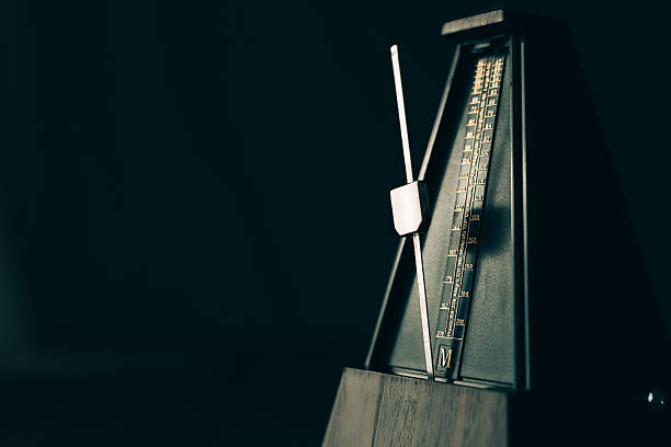 istock Vintage metronome, on a dark background. 492389266