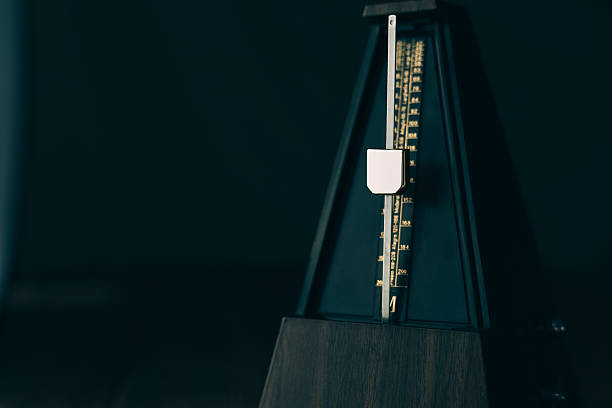 istock Vintage metronome, on a dark background. 492389308