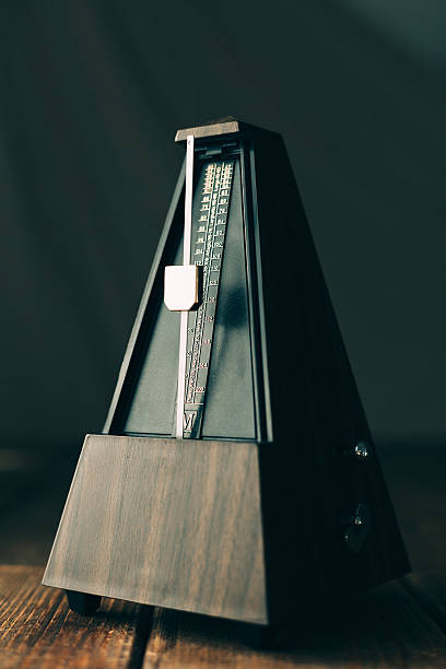 istock Vintage metronome, on a dark background. 492389326