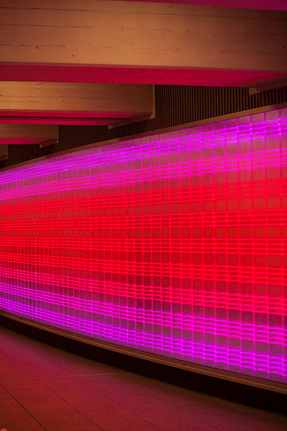 istock Red and pink neon lights of glassy wall 492391718