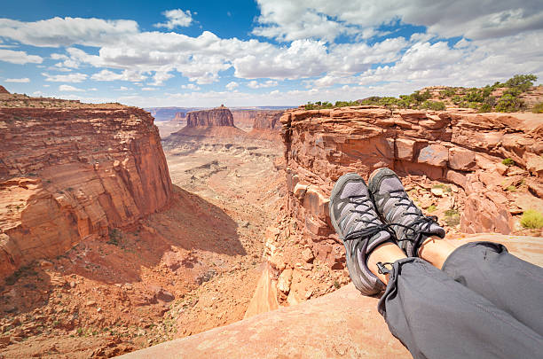 istock Resting tourist legs on top of a mountain. 492392086
