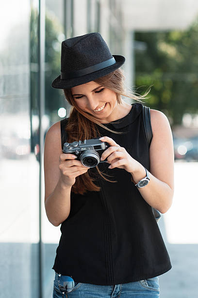 istock the smiling student photographs with digital mirrorless camera. 492392160