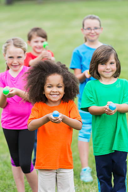istock Multiracial group of children in an egg spoon race 492392350