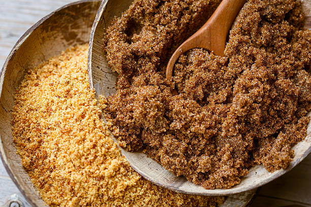 Soft brown dark sugar and unrefined sugar cane
