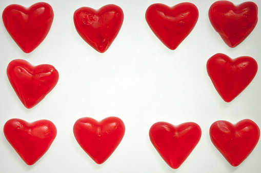 Heart shaped Valentine’s day gift box on red background