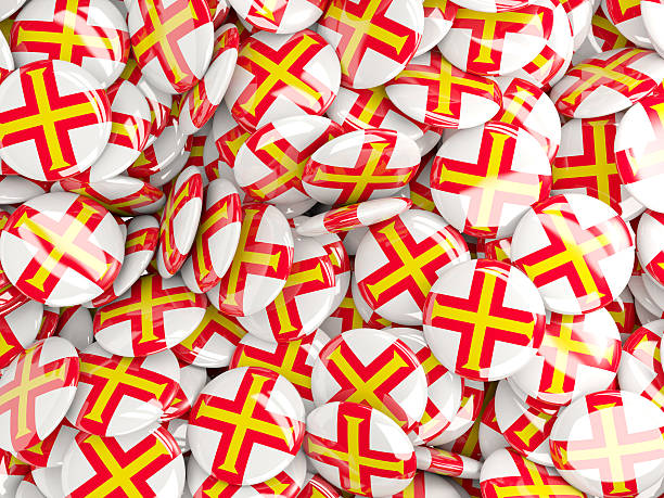 istock Background with round pins with flag of guernsey 492393440