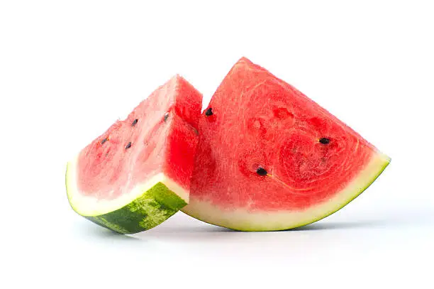 Photo of Two slices of watermelon on a white background.