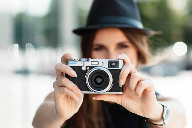 istock casual student photographs with digital camera. 492394048