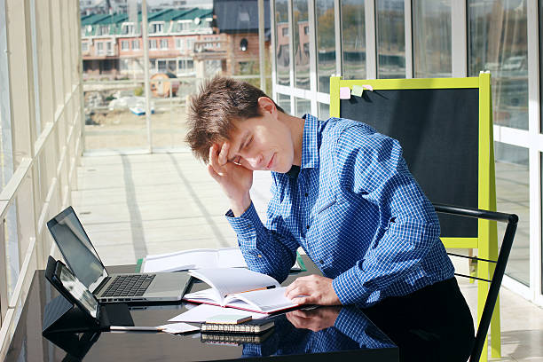 Headache at workplace. Difficulties, problems,fatigue, tiredness. stock photo