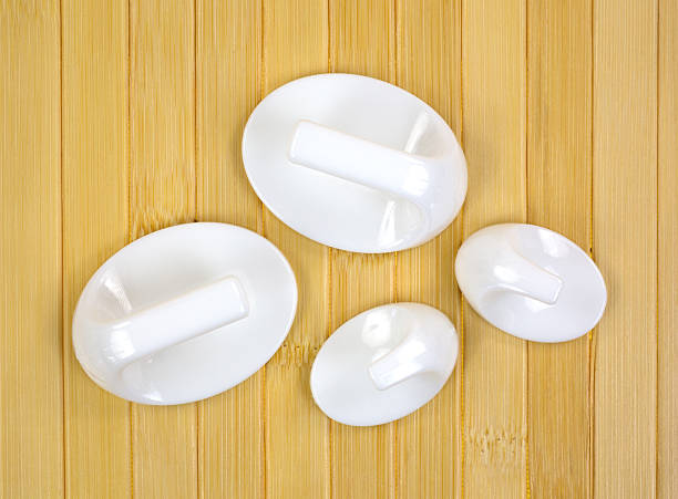 istock Plastic stick on mounting hooks on wood background 492394692