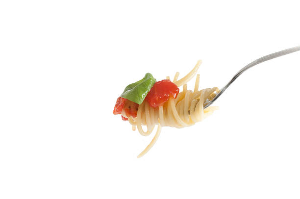 istock Spaghetti with fresh tomato rolled on fork. Traditional Italian 492396824