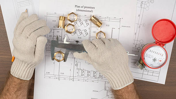 istock Mans hands in gloves holding trammel 492397220