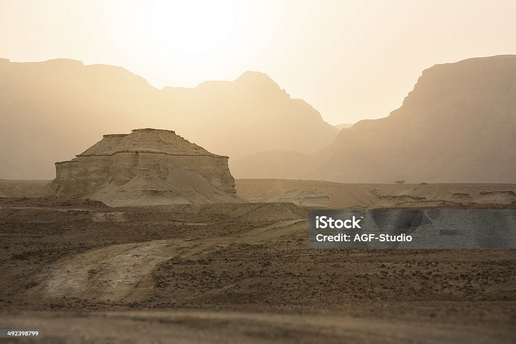 Road in a desert at the sunset Desert landscape Curve Stock Photo