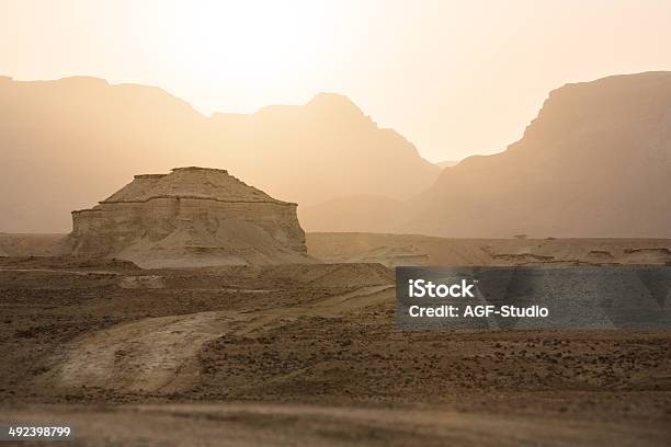 Road In A Desert At The Sunset Stock Photo - Download Image Now - Curve, Desert Road, Dusk