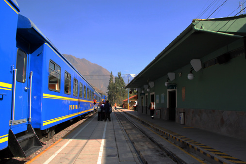 Ollantaytambo, Peru - August 11, 2010: Passengers board a PeruRail 'Expedition' train at Ollantaytambo station to take the journey to Aguas Calientes, to visit nearby Machu Pichu.