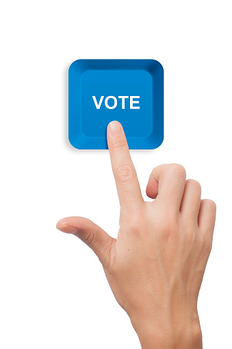 female hand pushing Vote keyboard button on white background