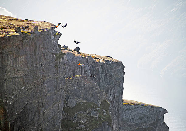 Freedom Base Jumping Freedom, flight. Base jumping from Kjeragbolten rock in Rogaland, Norway. Canon 5D. cliff jumping stock pictures, royalty-free photos & images